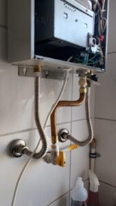 Trocado o flexível de gás e registro